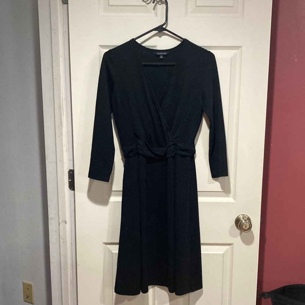 Lands End size2-4 slip on black dress with a low neck line.  3/4 length sleeves.